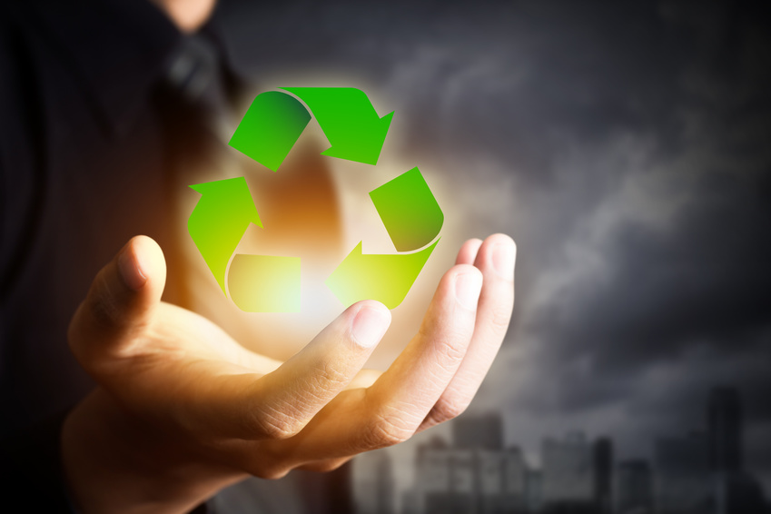 business people holding recycle sign