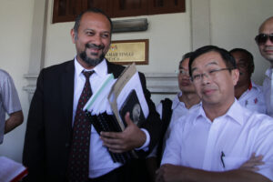 Counsel for the defendants Gobind Singh Deo (left) and DAP acting chairman Tan Kok Wai (right)